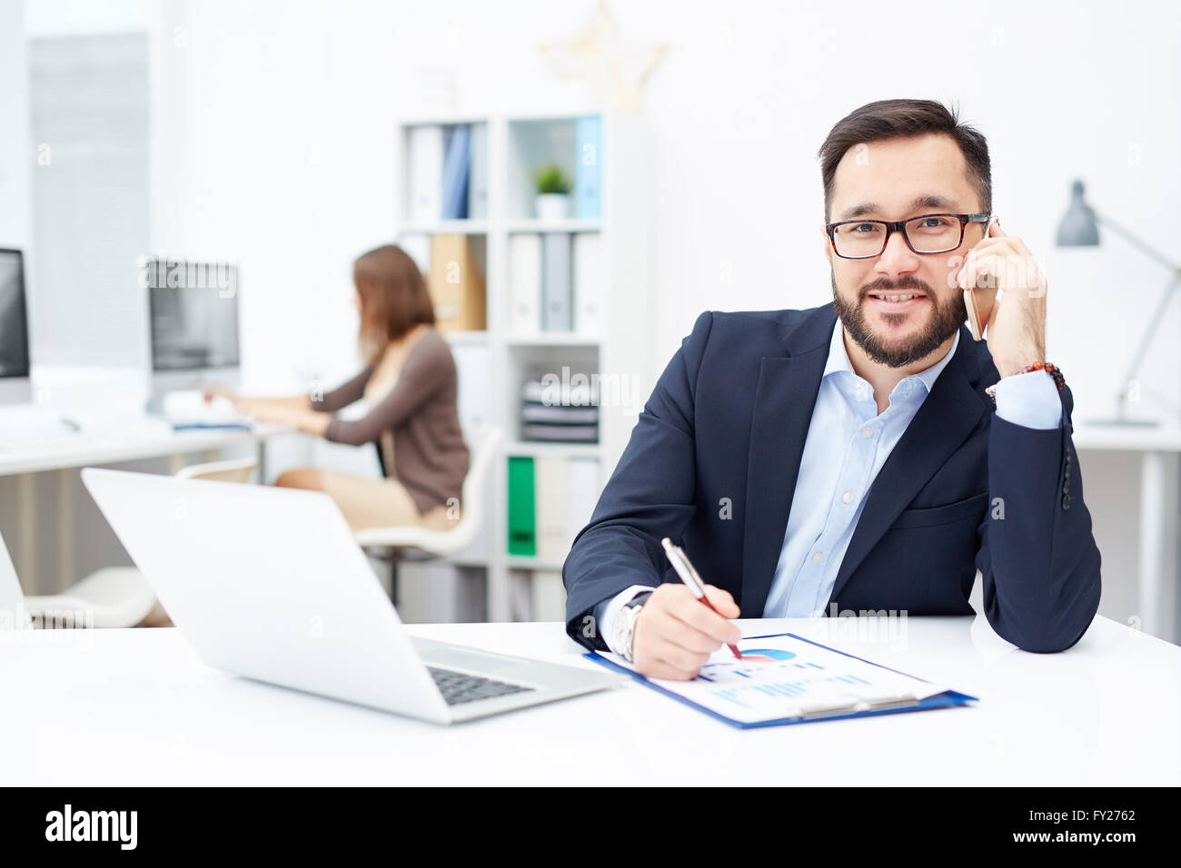 Busy office worker Stock Photo - Alamy