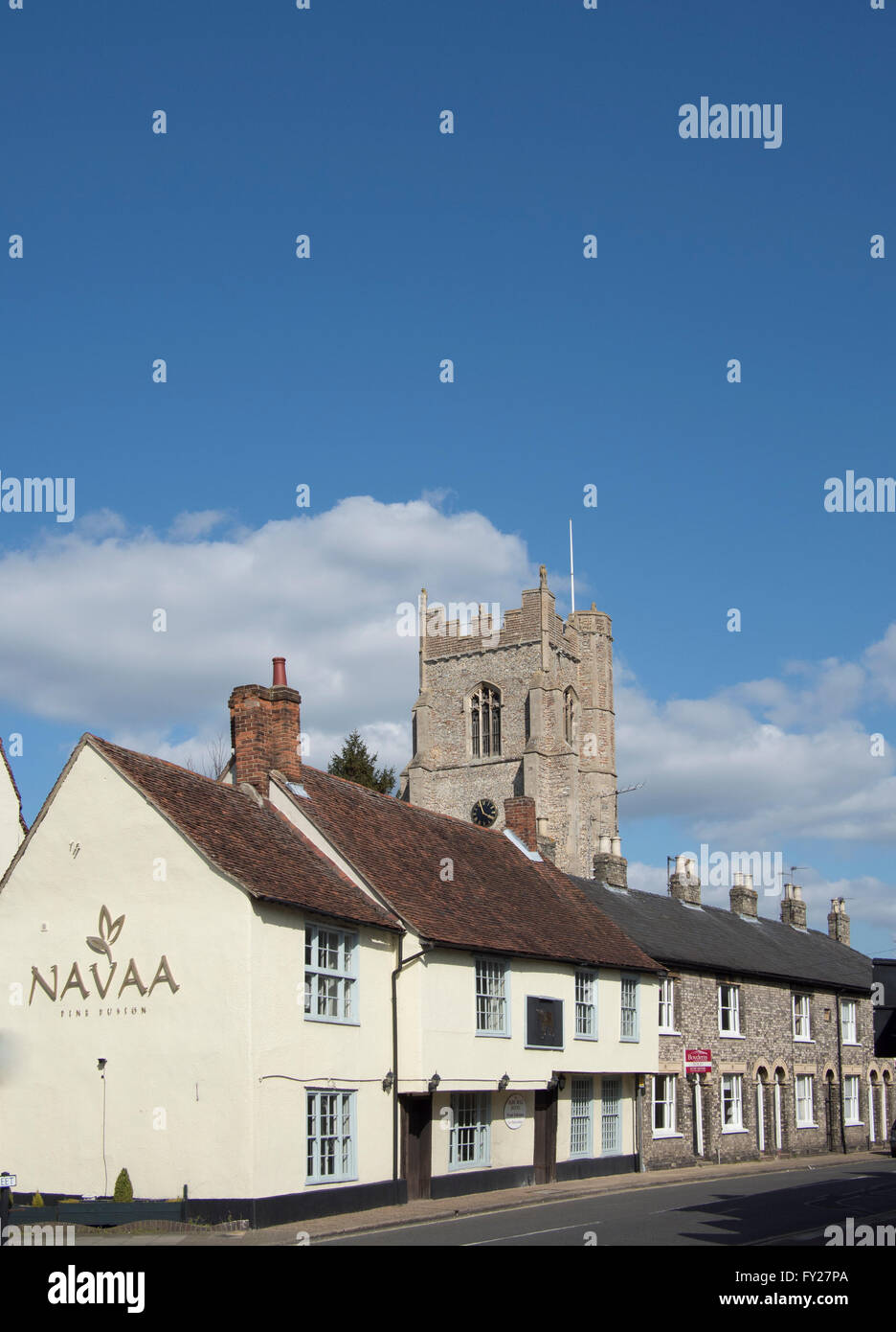 A view of old building and houses, with All St Church behind, in Church Street, Sudbury, Suffolk Stock Photo