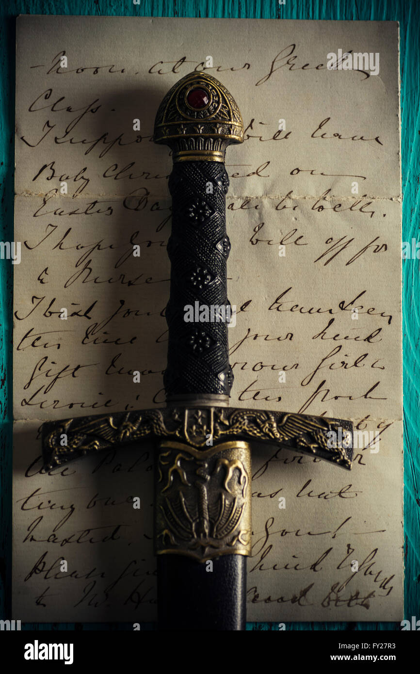 Historic dagger with an old letter Stock Photo