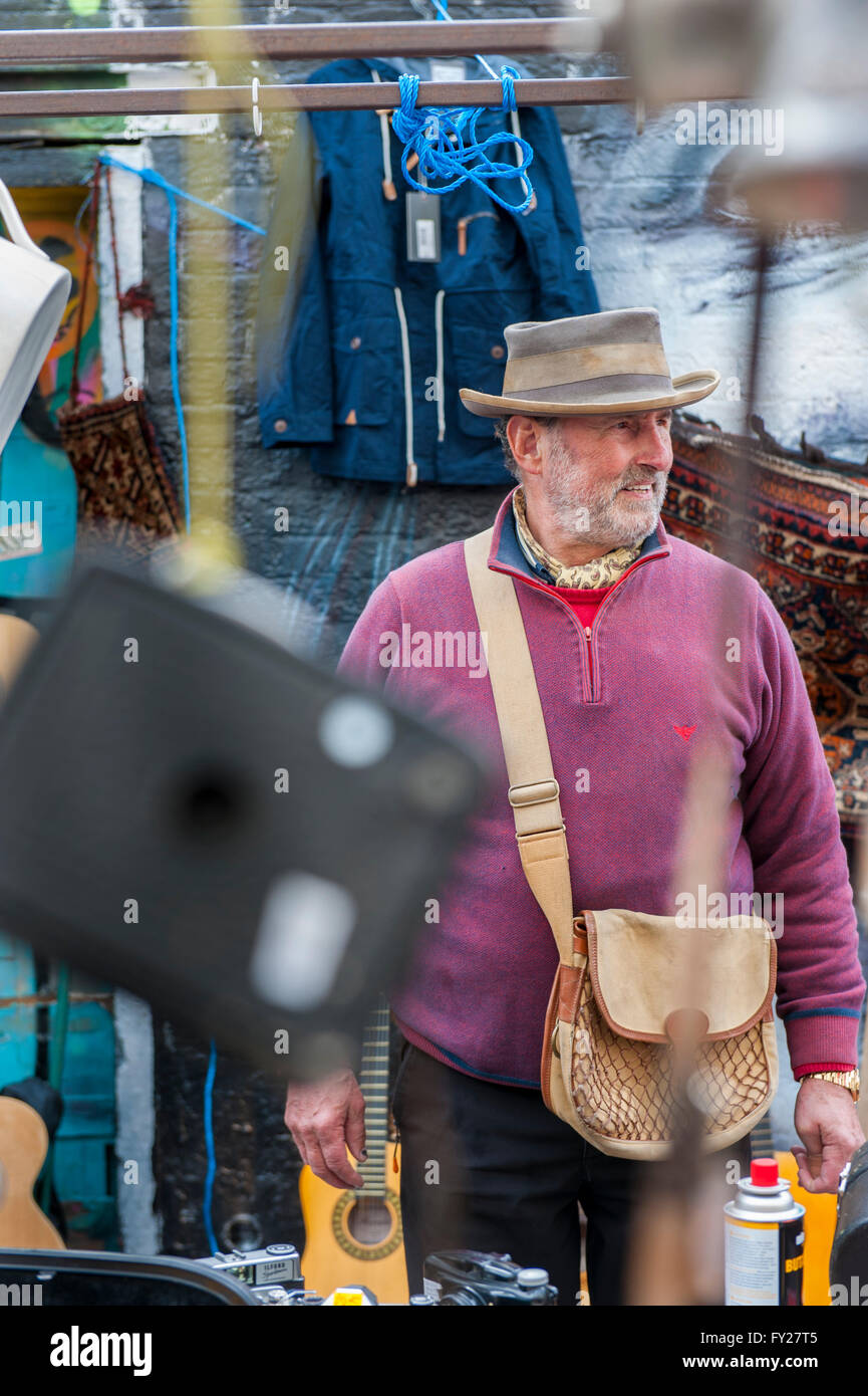 A market trader in pink jumper and hat in East London Shoreditch Stock Photo