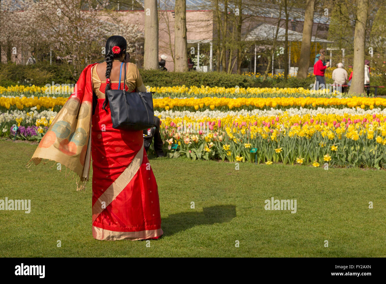 Multicultural visitor at the famous Keukenhof, one of the world's largest flower gardens, Lisse, South Holland, Netherlands. Stock Photo
