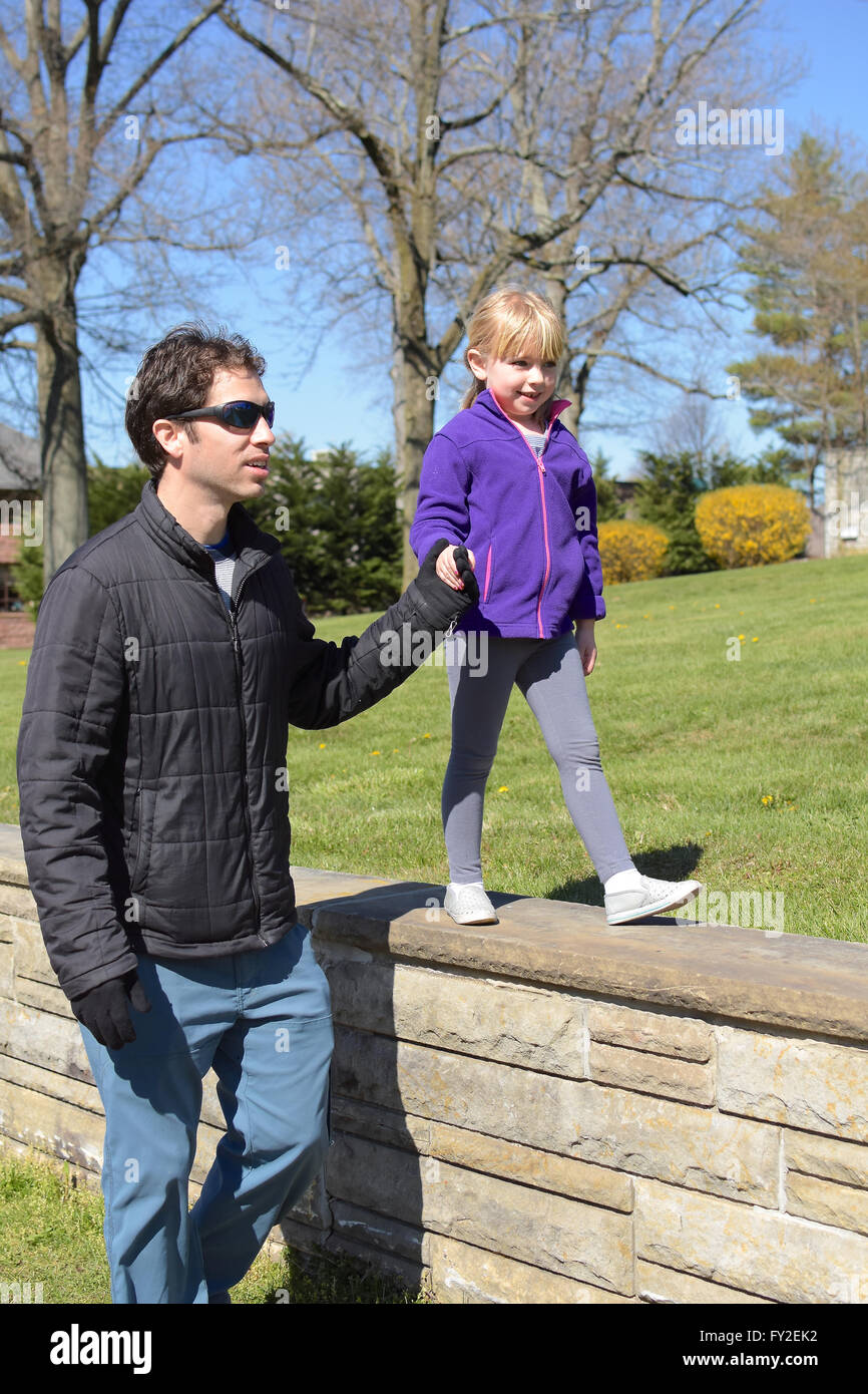 father and daughter walking and holding hands Stock Photo - Alamy