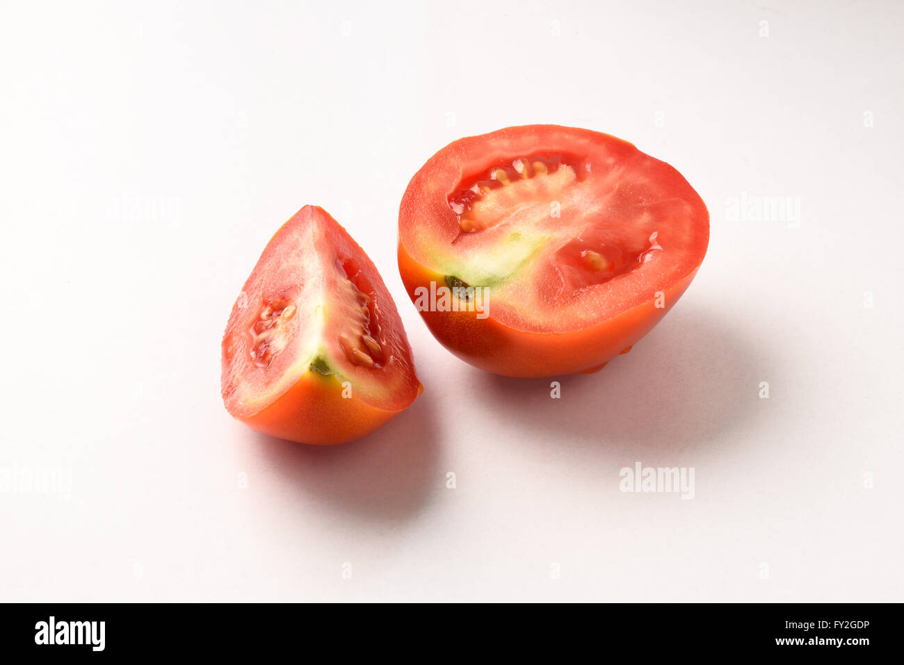 Fresh cut tomato in half Stock Photo Alamy