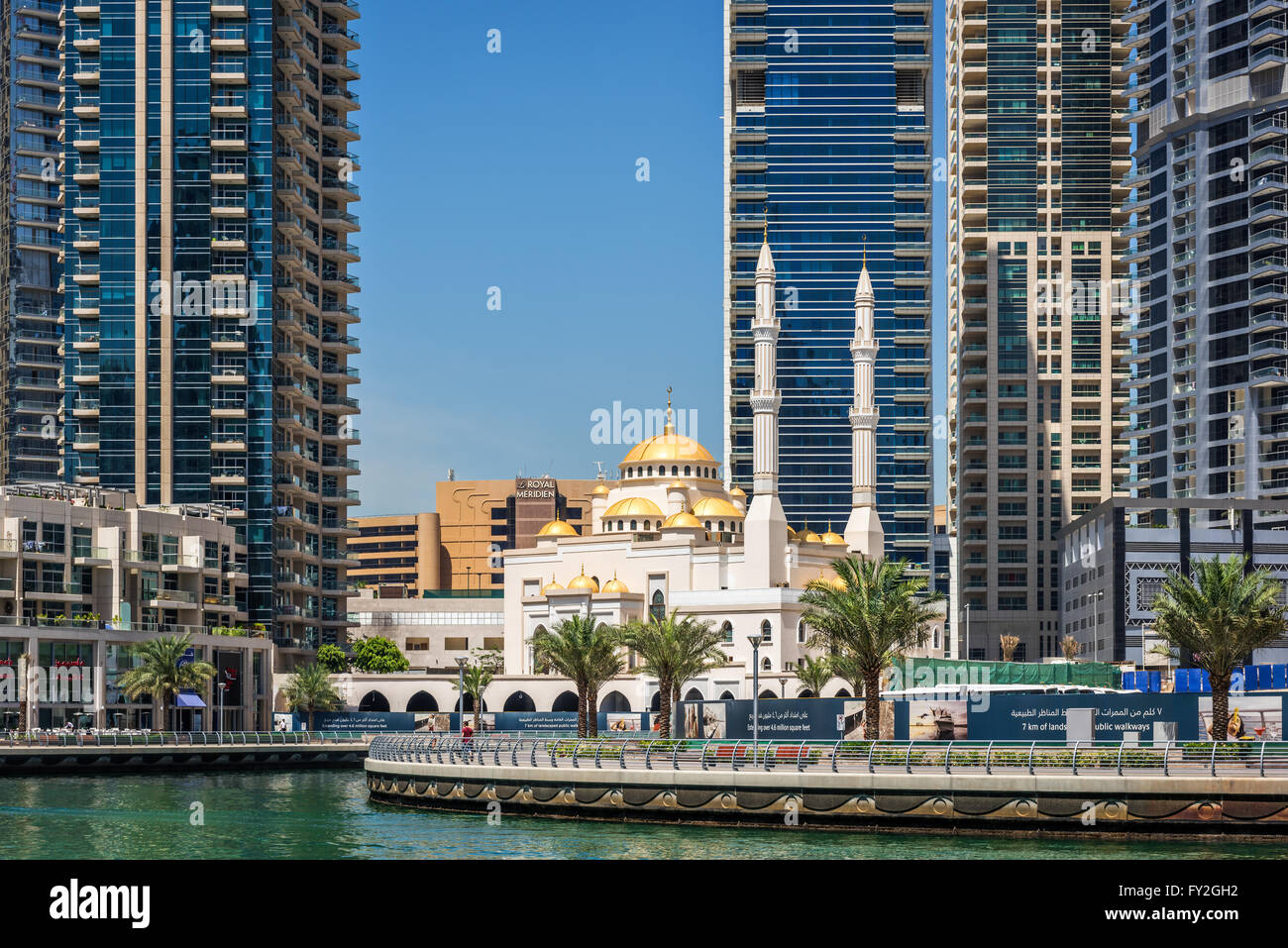 Mosque among modern high rise buildings, towers and hotels at Dubai Marina, United Arab Emirates, Middle East Stock Photo