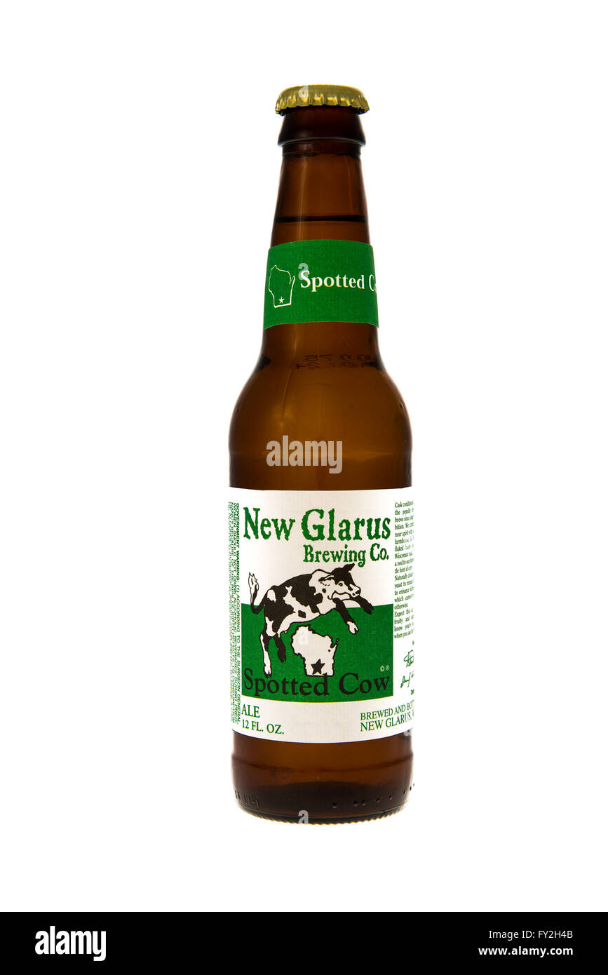 Winneconne, WI 11 February 2015 Bottle of New Glarus Spotted Cow beer brewed in Wisconsin