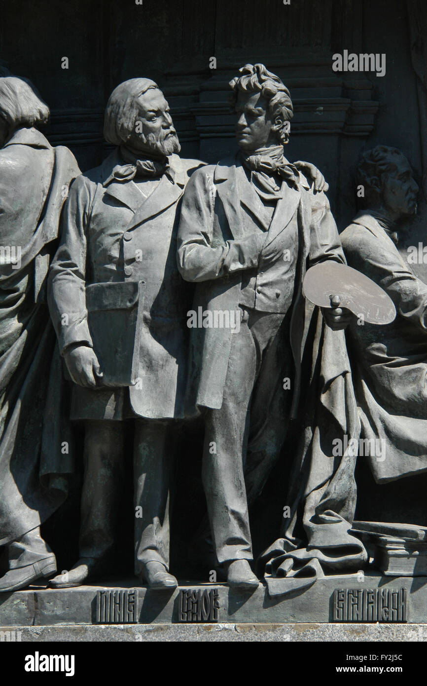 Russian composer Mikhail Glinka (L) and Russian painter Karl Bryullov (R) depicted in the bas relief dedicated to Russian writers and artists by Russian sculptor Ivan Schroder. Detail of the Monument to the Millennium of Russia (1862) designed by Mikhail Mikeshin in Veliky Novgorod, Russia. Stock Photo