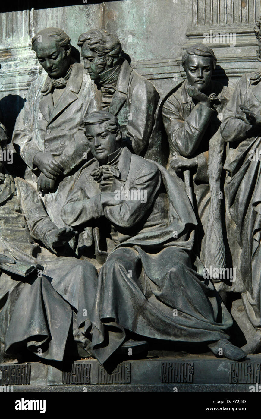 Russian writer and diplomat Alexander Griboyedov (sitting in the foreground), Russian poet and translator Vasily Zhukovsky, Russian poet and translator Nikolay Gnedich and Russian poet Mikhail Lermontov (standing from left to right) depicted in the bas relief dedicated to Russian writers and artists by Russian sculptor Ivan Schroder. Detail of the Monument to the Millennium of Russia (1862) designed by Mikhail Mikeshin in Veliky Novgorod, Russia. Stock Photo