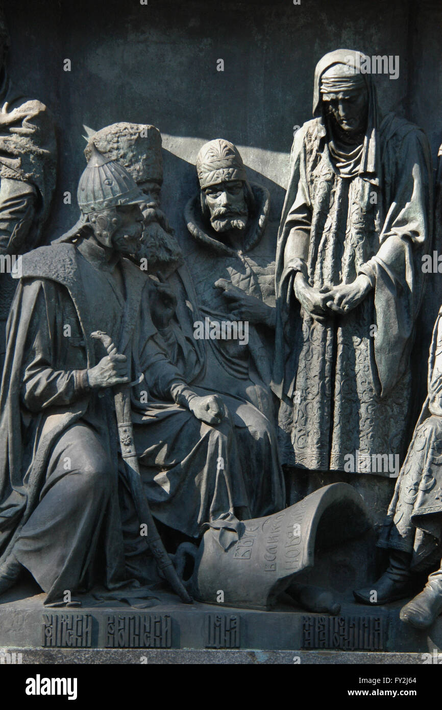 Russian military leaders Daniil Kholmsky, Mikhail Vorotynsky and Daniil Shchenya and Marfa Boretskaya who led the struggle of the Novgorod Republic against Muscovy depicted (from left to right) in the bas relief dedicated to Russian military leaders and heroes by Russian sculptors Matvey Chizhov and Alexander Lubimov. Detail of the Monument to the Millennium of Russia (1862) designed by Mikhail Mikeshin in Veliky Novgorod, Russia. The broken Novgorod veche bell is depicted in front of Marfa Boretskaya. Stock Photo