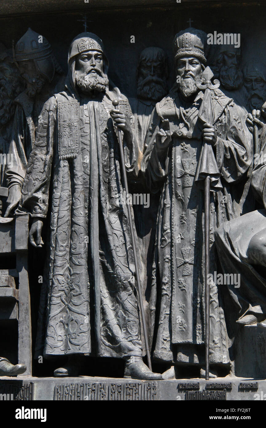 Patriarch Nikon of Moscow (L) and Saint Dimitry of Rostov (R) depicted in the bas relief dedicated to Russian men of enlightenment by Russian sculptor Matvey Chizhov. Detail of the Monument to the Millennium of Russia (1862) designed by Mikhail Mikeshin in Veliky Novgorod, Russia. Prince Konstanty Wasyl Ostrogski is depicted in the background in the right. Philanthropist Fyodor Rtishchev is depicted in background in the middle. Saint Tikhon of Zadonsk (L) and Saint Mitrophan of Voronezh (R) are depicted in the background in the left. Stock Photo