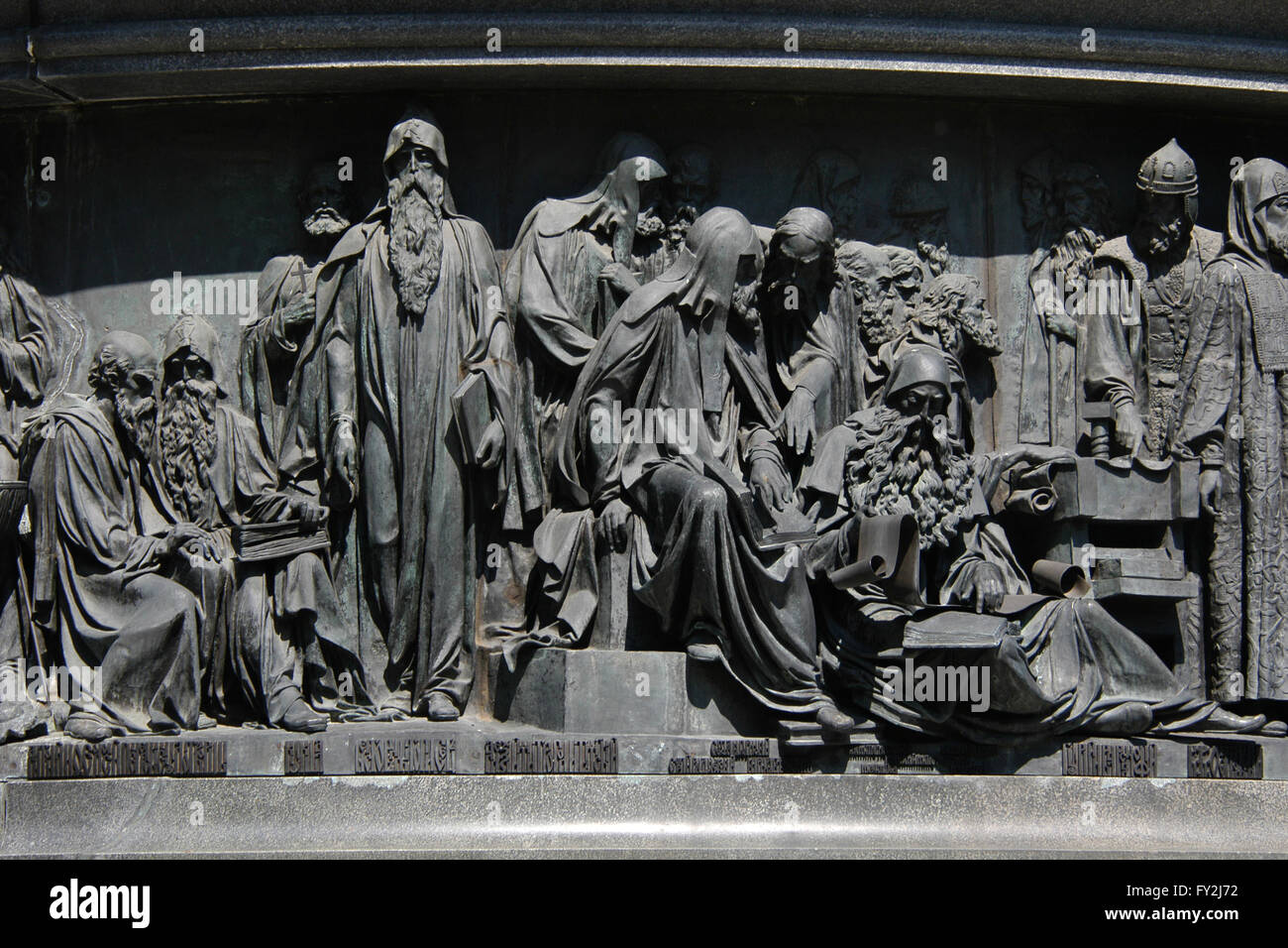 Russian Saints and spiritual leaders depicted in the bas relief by sculptor Matvey Chizhov. Detail of the Monument to the Millennium of Russia (1862) designed by Mikhail Mikeshin in Veliky Novgorod, Russia. Persons from left to right: Anthony and Theodosius of Kiev, Kuksha of the Kiev Caves, Nestor the Chronicler, Cyril of Beloozero and Stephen of Perm, Metropolitan Alexius of Moscow and Sergius of Radonezh (both sitting), Metropolitan Peter Mogila of Kiev and Metropolitan Jonah of Moscow (both standing in the background), Maximus the Greek (sitting), Saints Zosima and Sabbatius of Solovki, Me Stock Photo