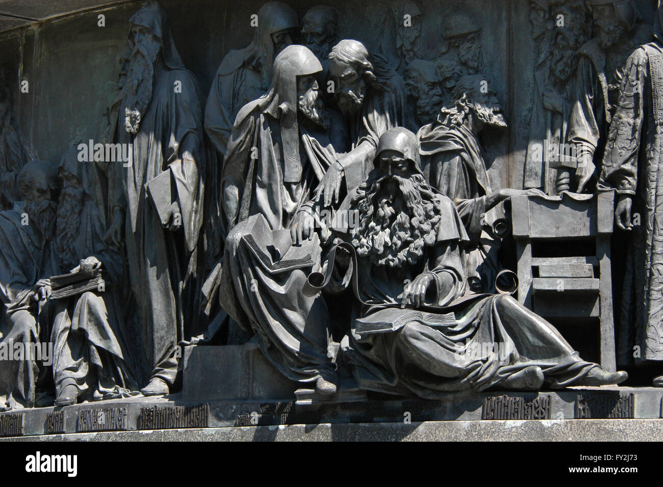 Metropolitan Alexius of Moscow, Saint Sergius of Radonezh and Maximus the Greek depicted (sitting from left to right) in the bas relief dedicated to Russian men of enlightenment by Russian sculptor Matvey Chizhov. Detail of the Monument to the Millennium of Russia (1862) designed by Mikhail Mikeshin in Veliky Novgorod, Russia. Saints Anthony and Theodosius of Kiev, Kuksha of the Kiev Caves, Nestor the Chronicler, Cyril of Beloozero and Stephen of Perm, Metropolitan Peter Mogila of Kiev, Saints Zosima and Sabbatius of Solovki, Metropolitan Jonah of Moscow, Metropolitan Macarius of Moscow, Archb Stock Photo