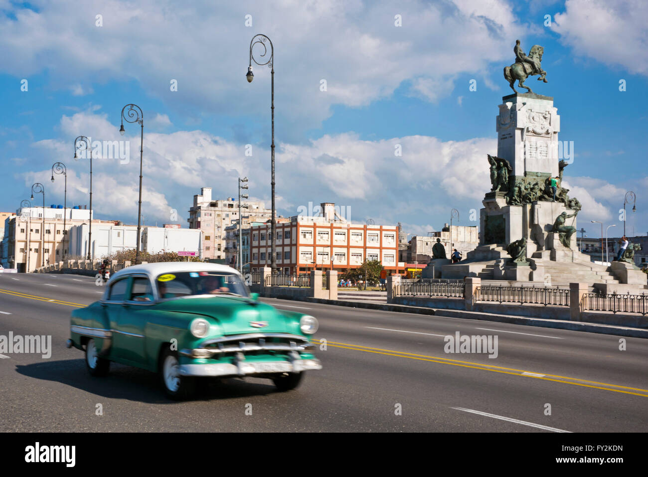 Horizontal view of a classic American car driving down the Malecon in Havana, Cuba. Stock Photo