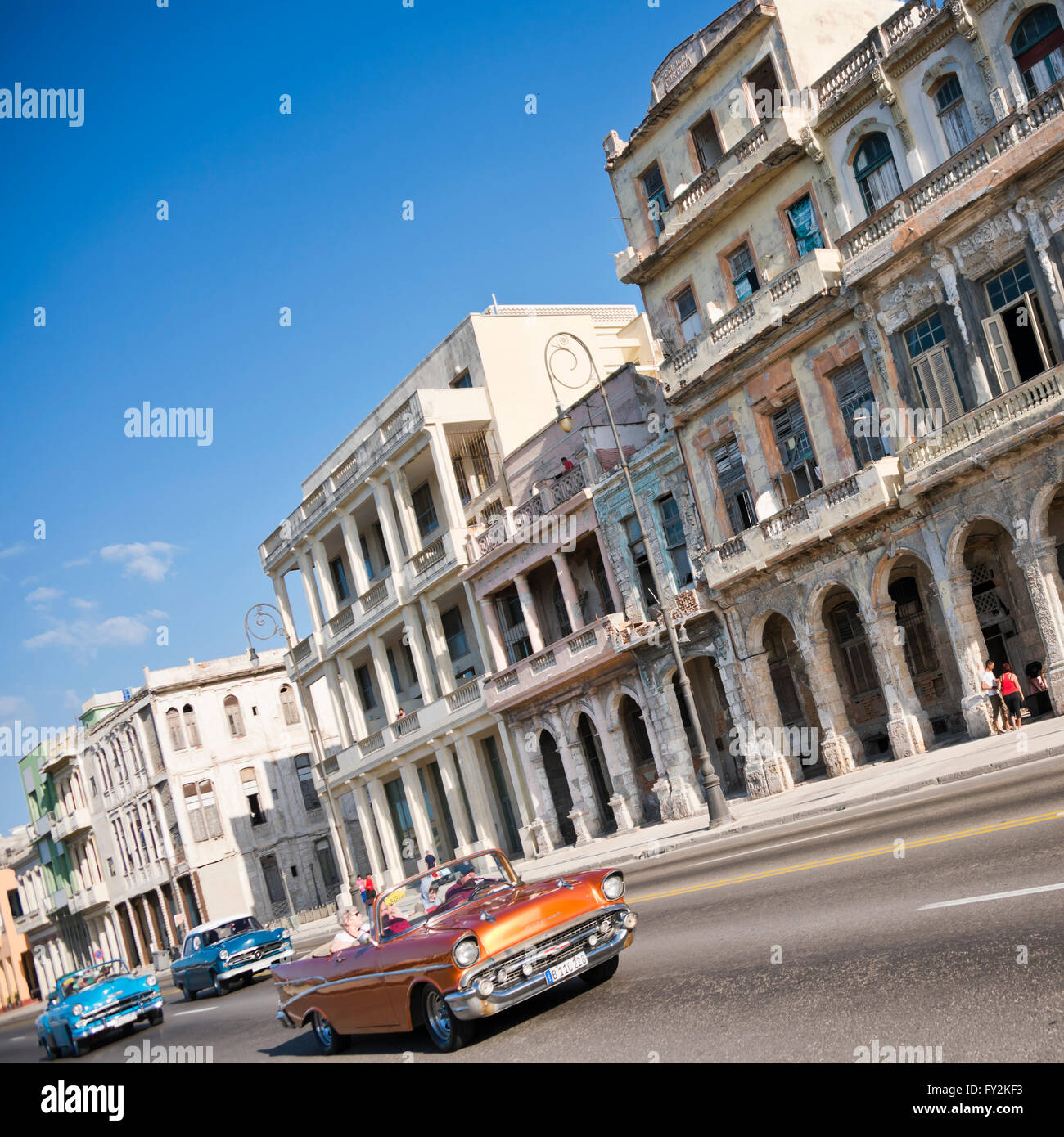 Square streetview of classic American cars driving down the Malecon in Havana, Cuba. Stock Photo