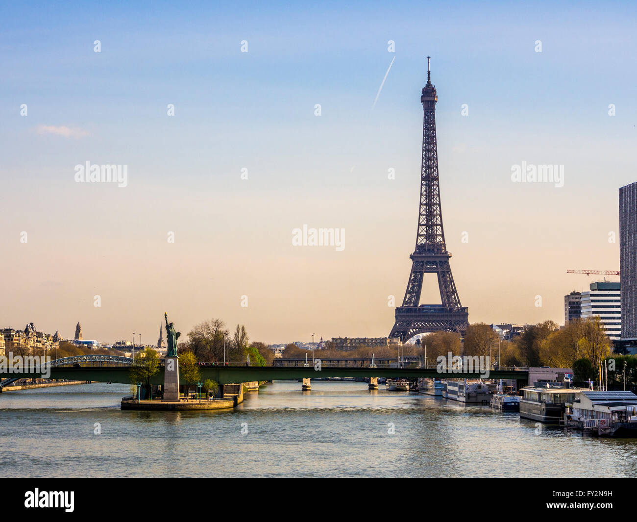 Pont de Grenelle over the river Seine in Paris with replica Statue of