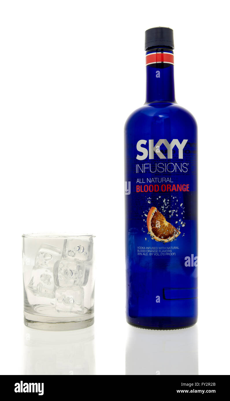 Winneconne, WI - 15 March 2016:  A bottle of Skyy Infusions blood orange vodka with a glass of ice Stock Photo