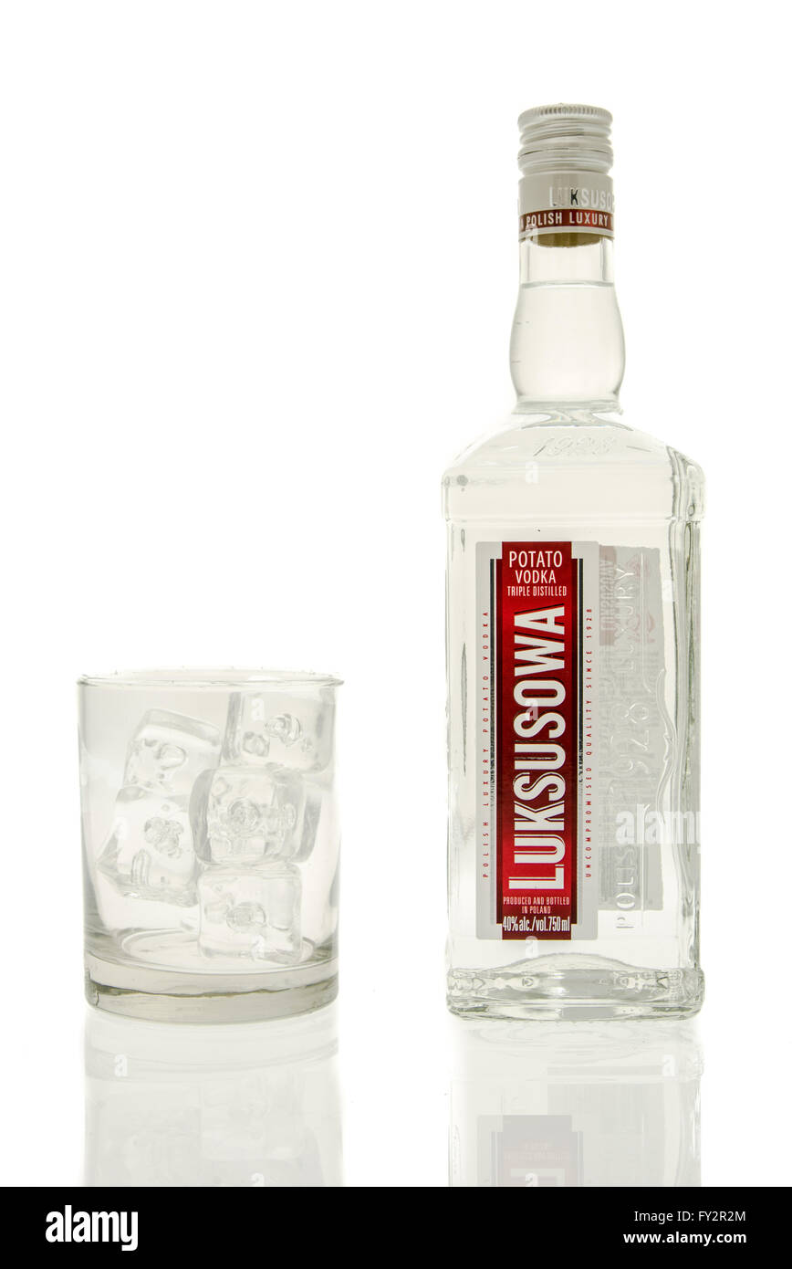 Winneconne, WI - 15 March 2016:  A bottle of Luksusowa vodka with a glass of ice Stock Photo