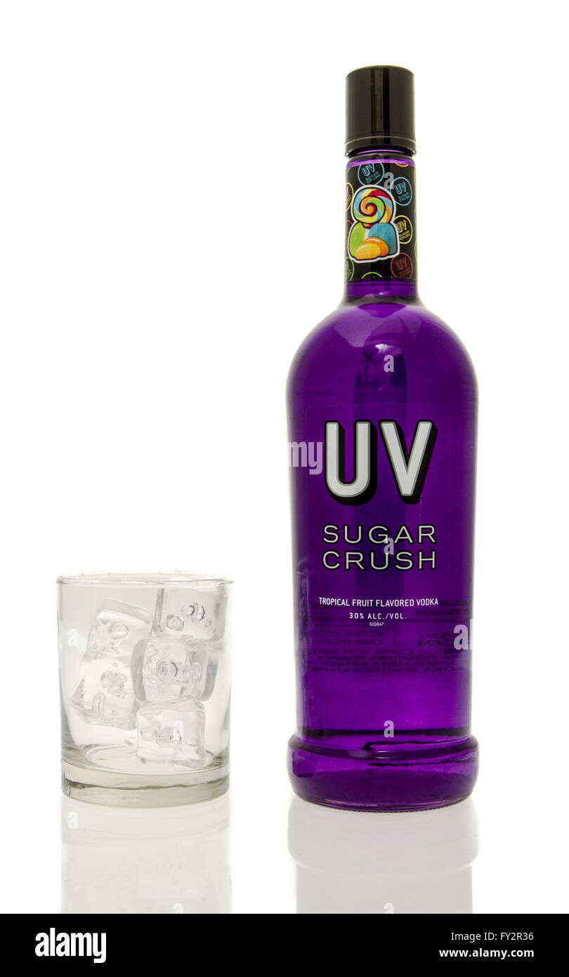 Winneconne, WI - 15 March 2016:  A bottle of UV sugar cruch vodka with a glass of ice Stock Photo