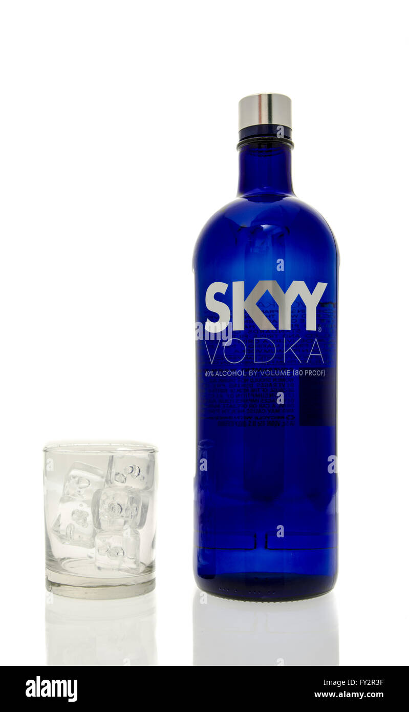 Winneconne, WI - 15 March 2016:  A bottle of Skyy vodka with a glass of ice Stock Photo