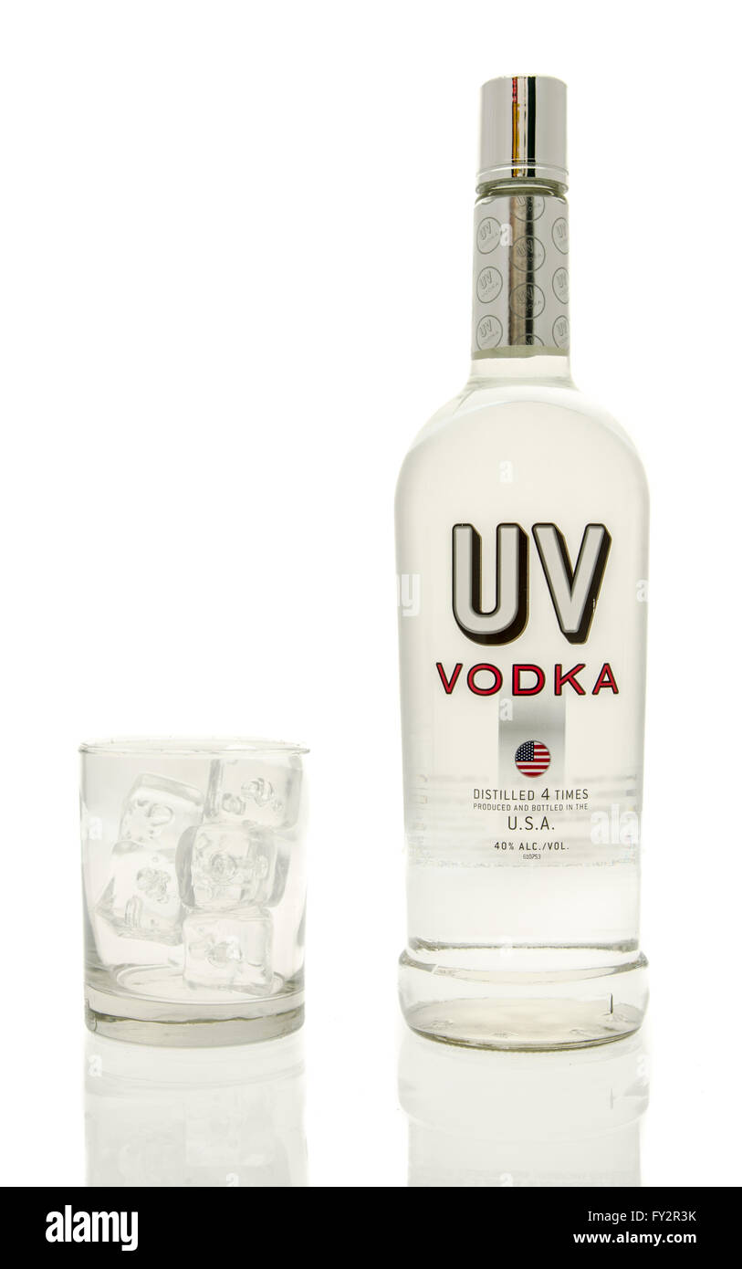 Winneconne, WI - 15 March 2016:  A bottle of UV vodka with a glass of ice Stock Photo