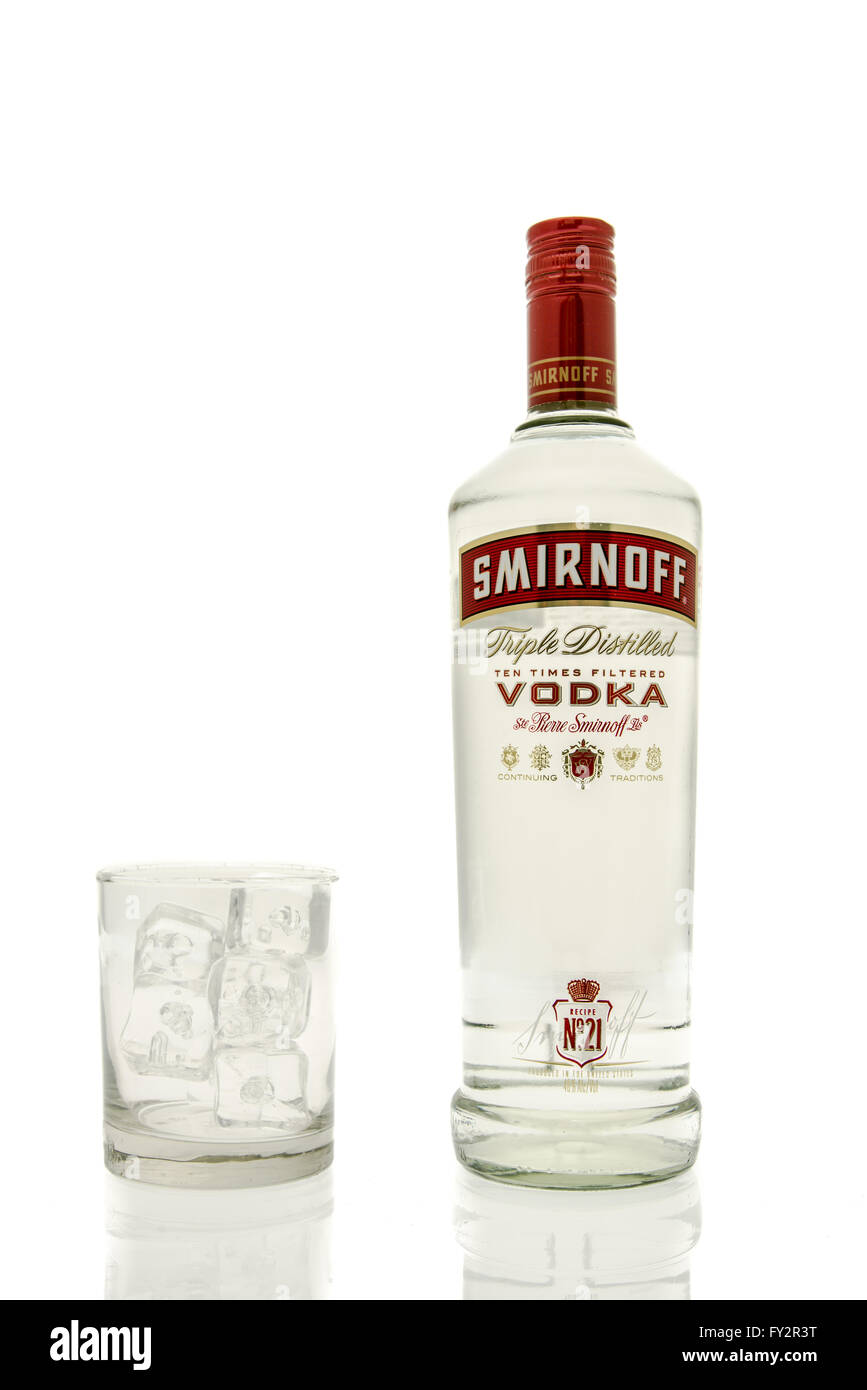 Winneconne, WI - 15 March 2016:  A bottle of Smirnoff vodka with a glass of ice Stock Photo