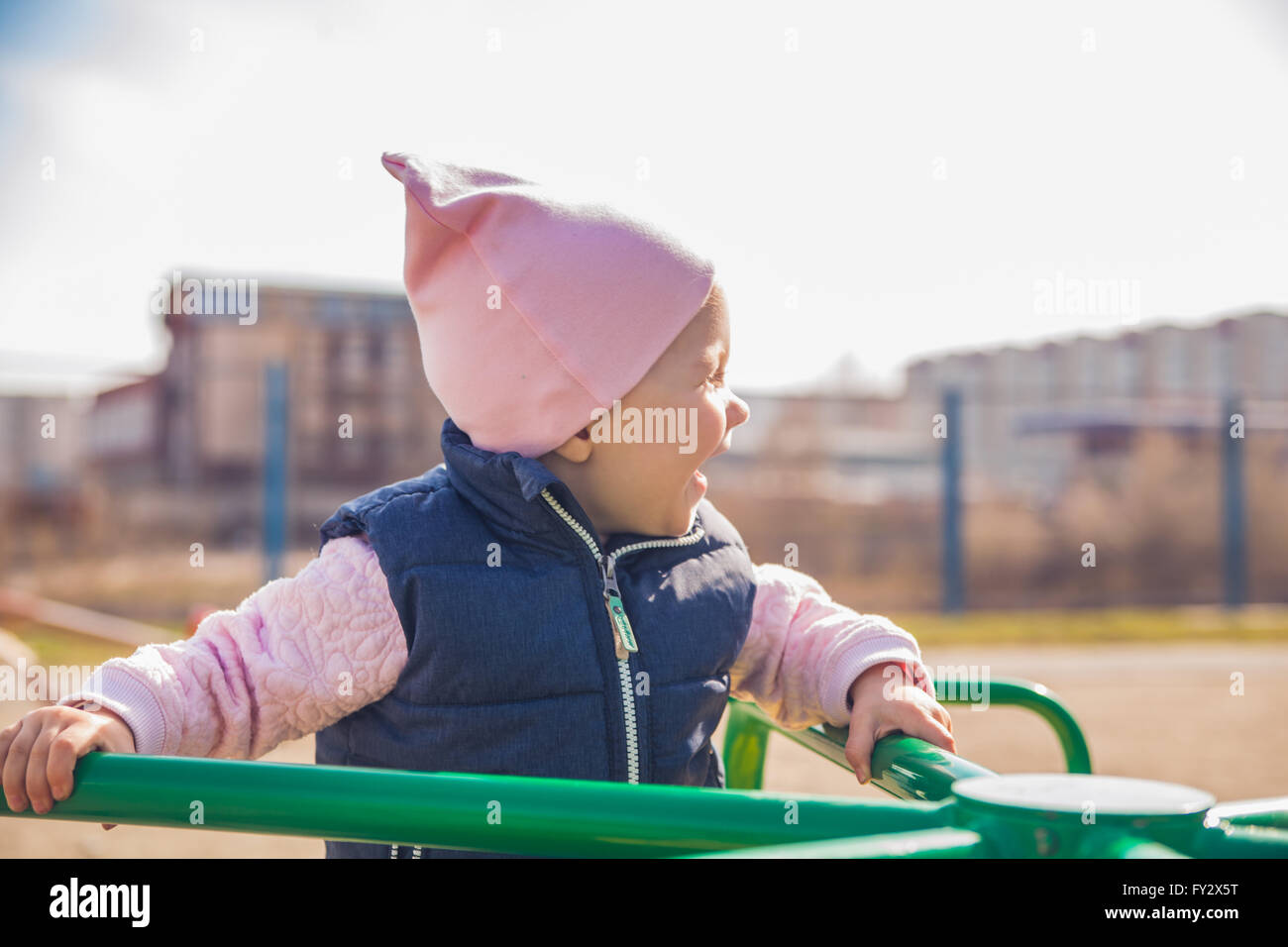 Little girl having fun in amusement park Stock Photo - Alamy