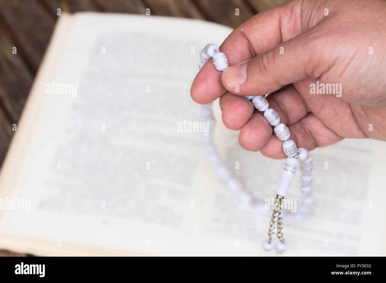 Holy Quran with beads Stock Photo