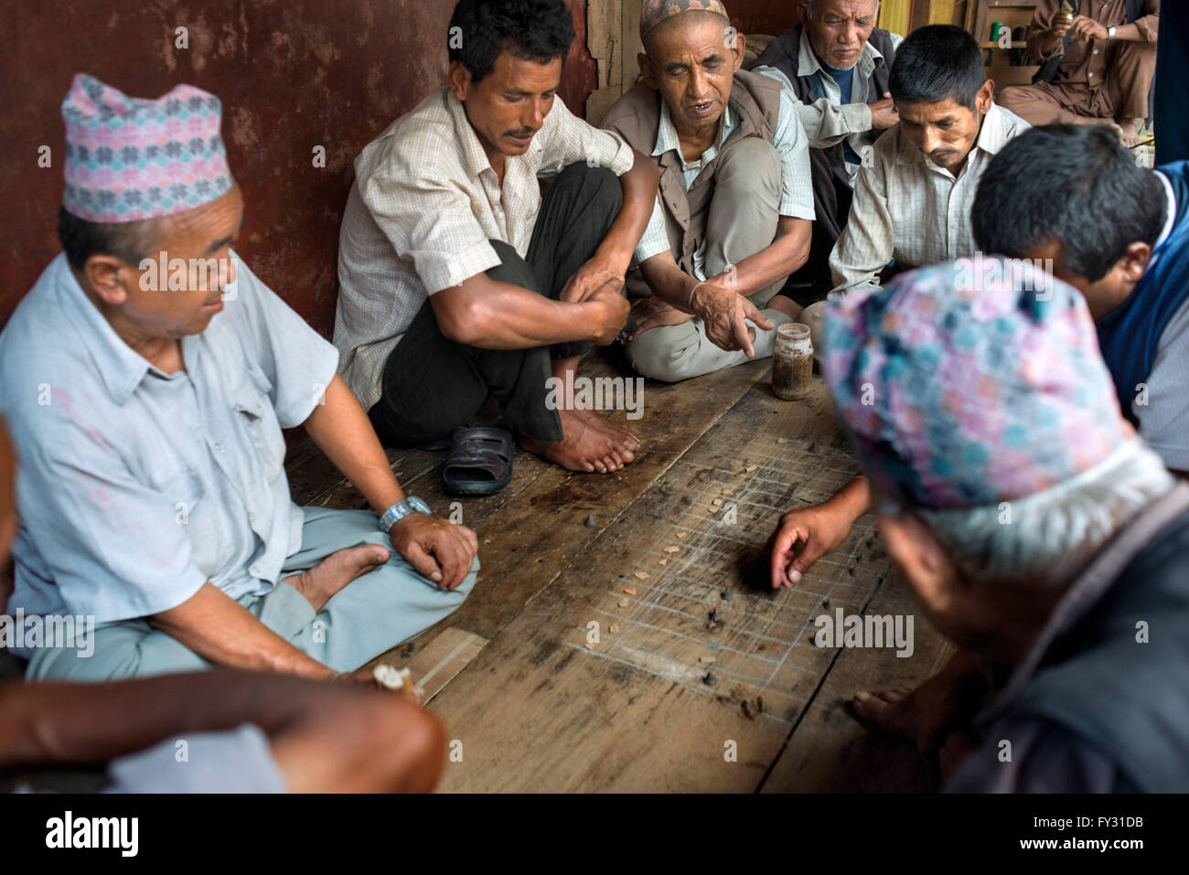 People playing Bagh-Chal game at Bhaktapur Durbar Square, Nepal. Bhaktapur listed as a World Heritage Site by UNESCO Stock Photo