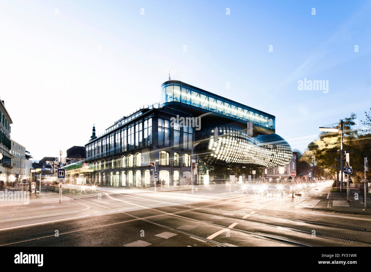 Kunsthaus Graz and road intersection at dusk Stock Photo