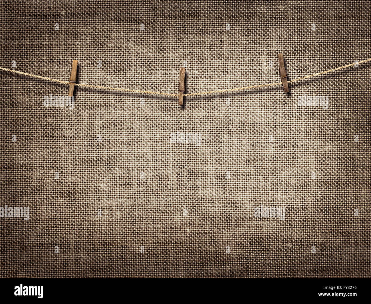 clothesline with clothespins on linen background Stock Photo Alamy