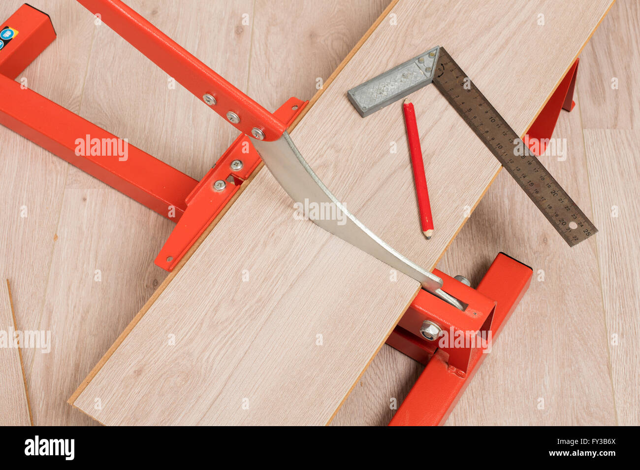 Red Tool For Cutting Laminate On A Laminate Floor Stock
