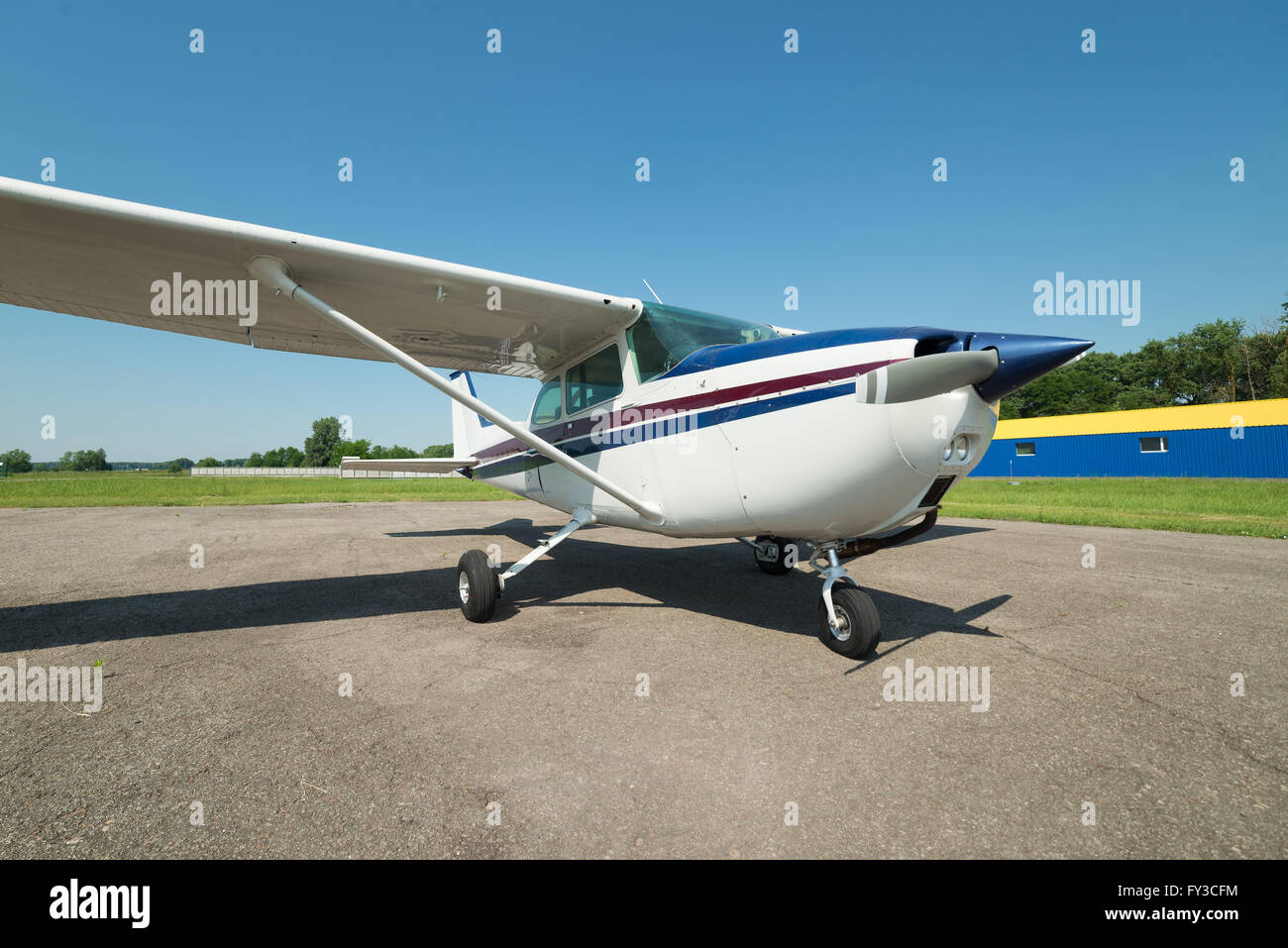Light private plane parked on the airfield waiting for a new flying day Stock Photo
