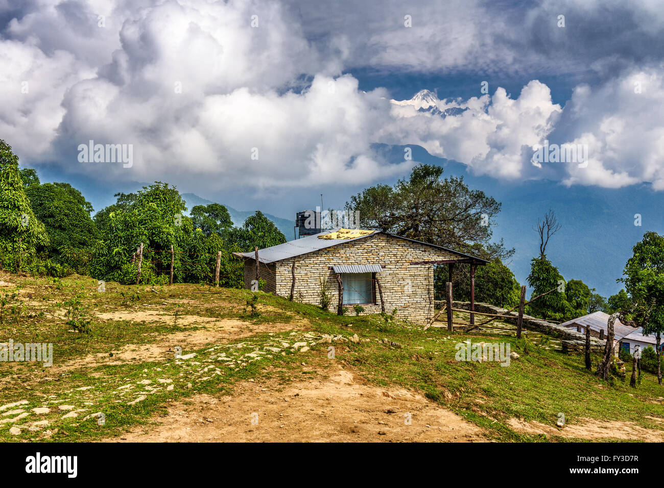 Old stone cabin under Annapurna mountain  in the Himalayas in Nepal Stock Photo