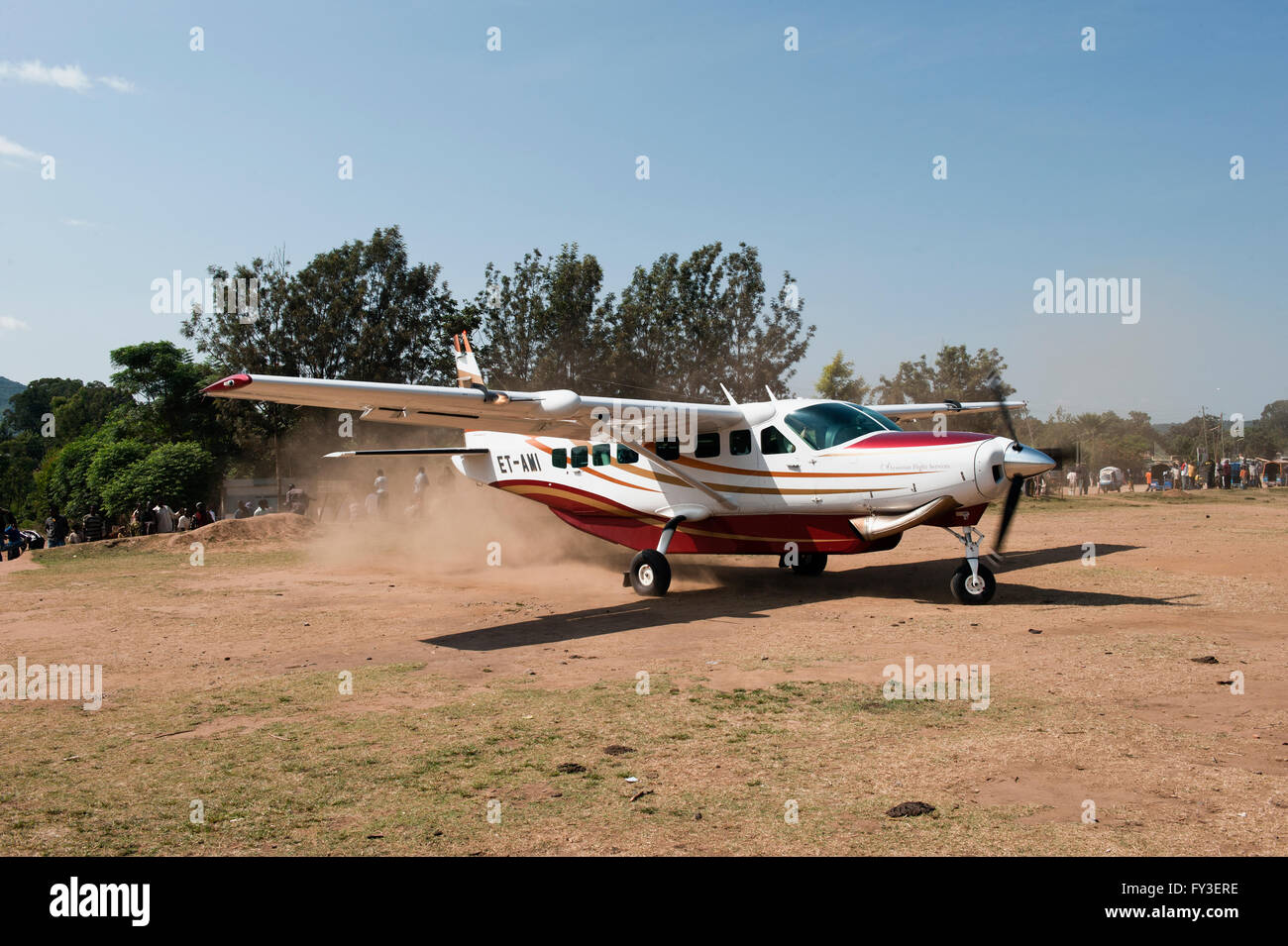 Small plane landing at the Jinka airstrip, Omo River Valley, Ethiopia Stock Photo