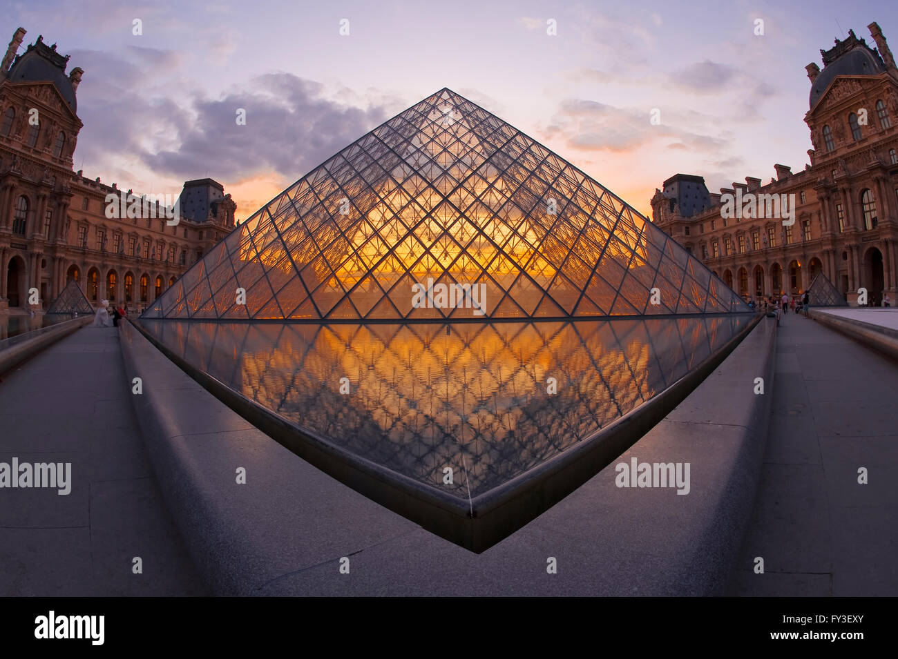 Louvre Pyramide at sunset, Paris, France Pyramide du Louvre au coucher de soleil, Paris, France Stock Photo