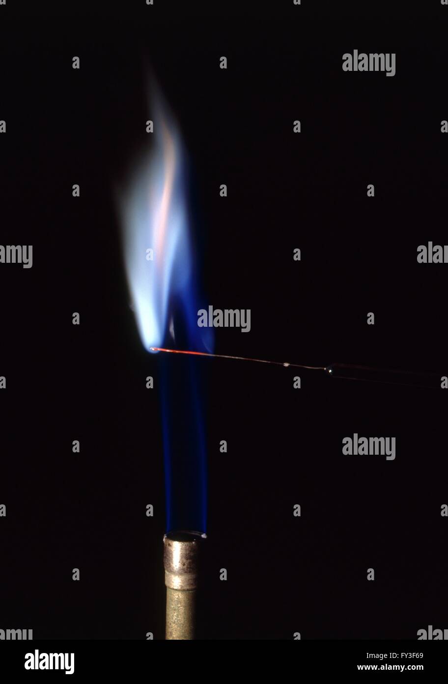 Lead compound burning with blue flame Stock Photo