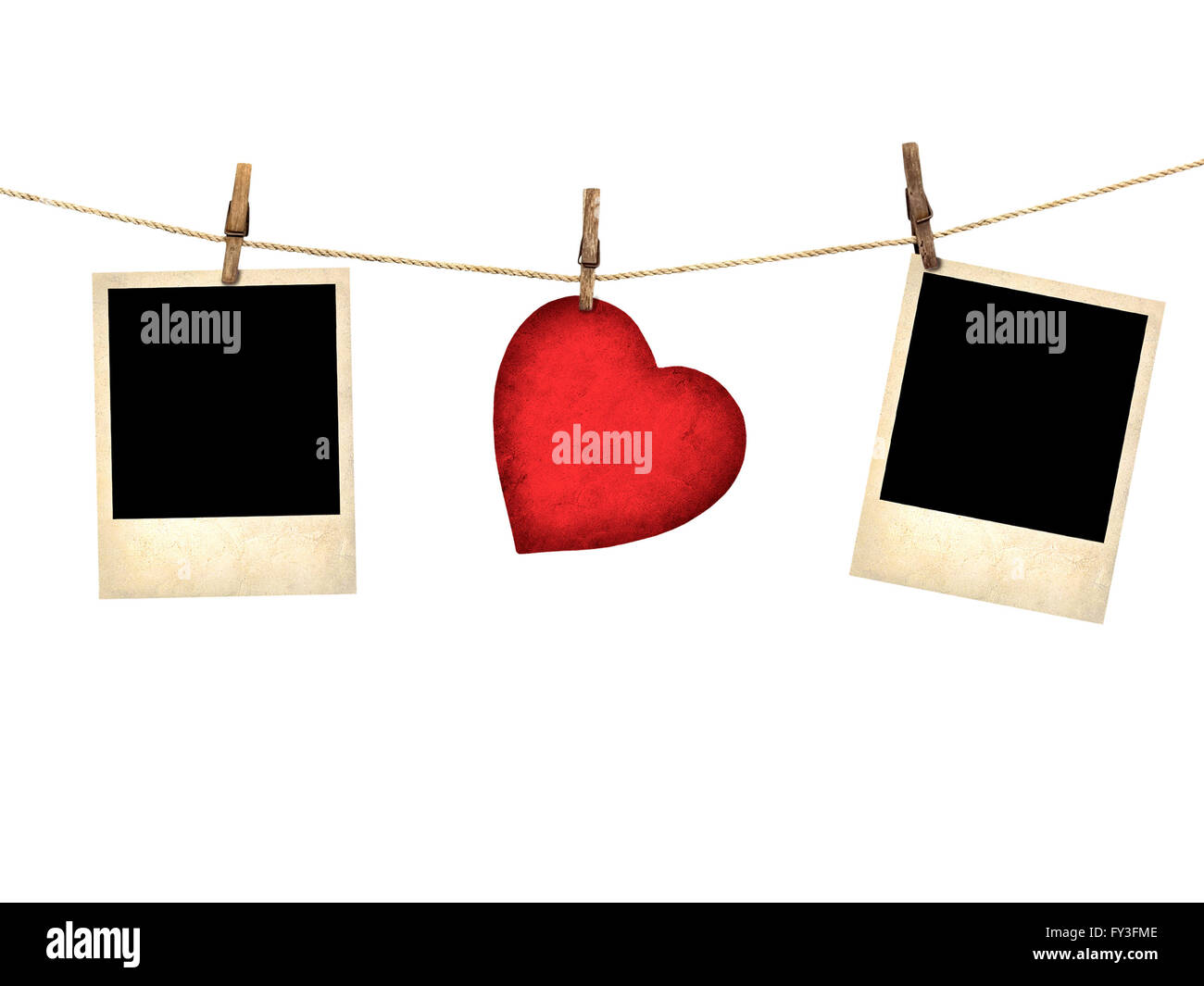 Old style photo and Valentine card heart shaped from old red paperr hanging on a clothesline isolated on white Stock Photo