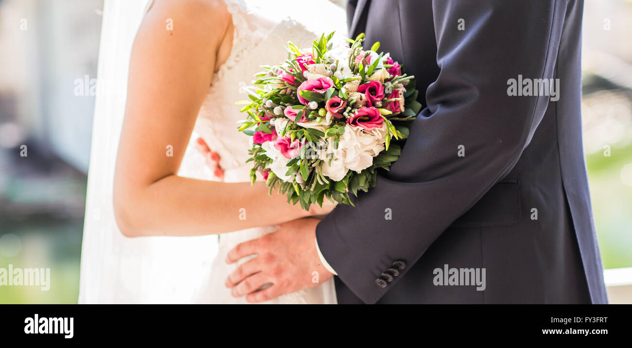Kiss the bride and groom Stock Photo - Alamy