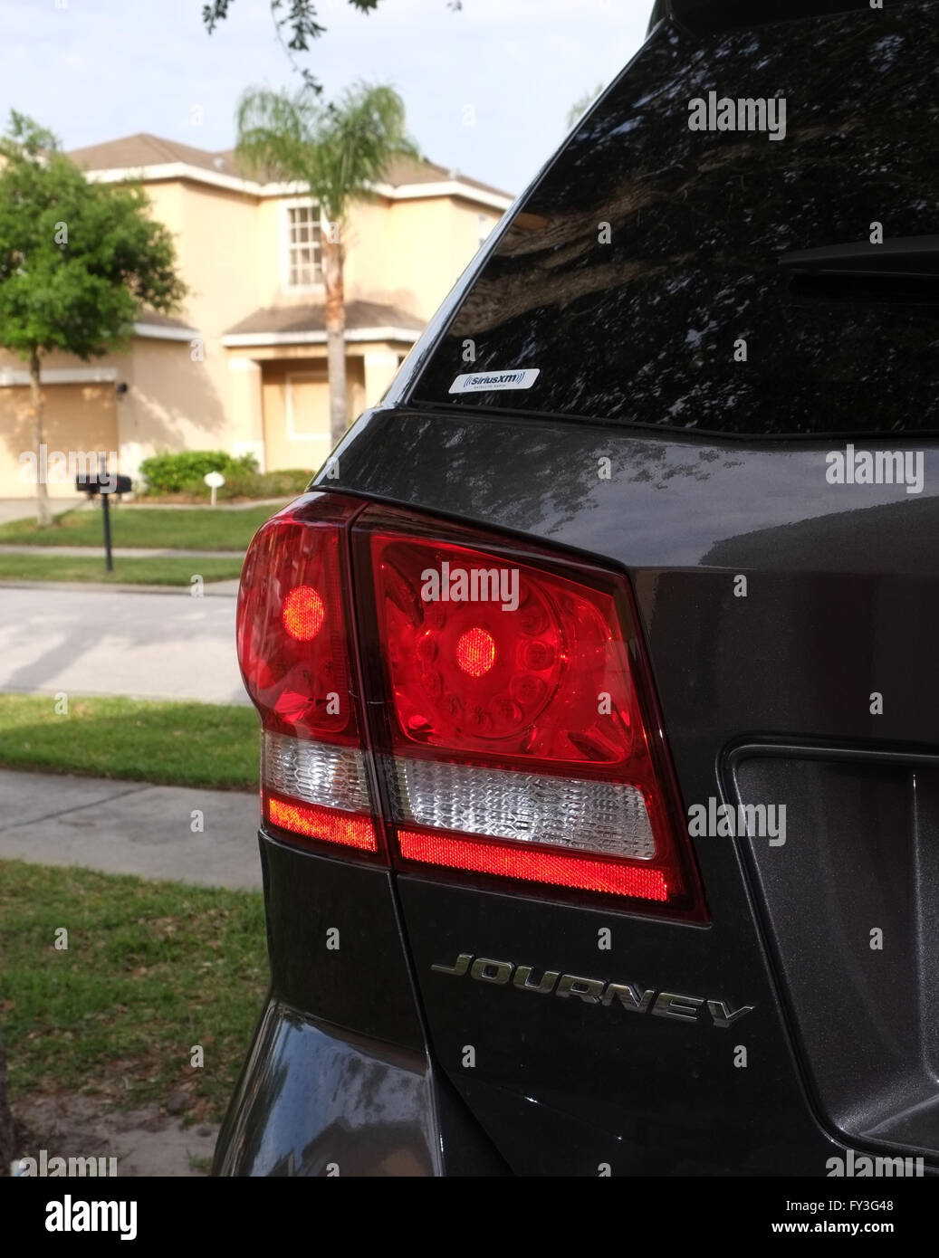 Modern American SUV, Dodge Journey details on a residential driveway in Florida, USA April 2016 Stock Photo