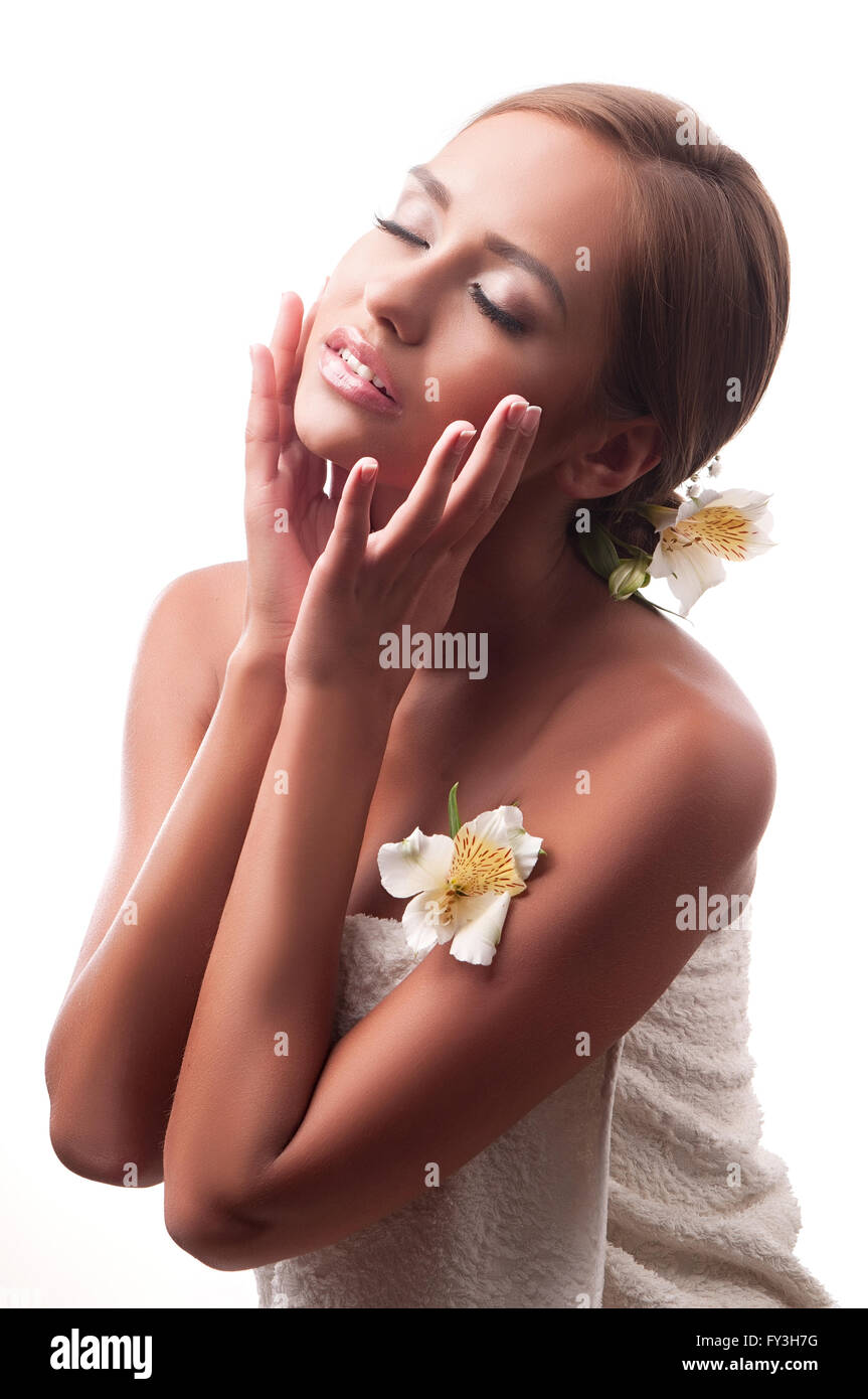 Beautiful young woman having a massage in a spa Stock Photo