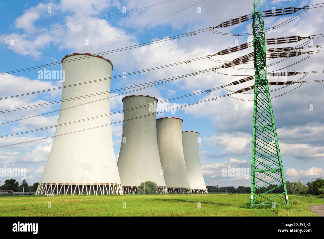 High-voltage line in front of cooling towers Stock Photo