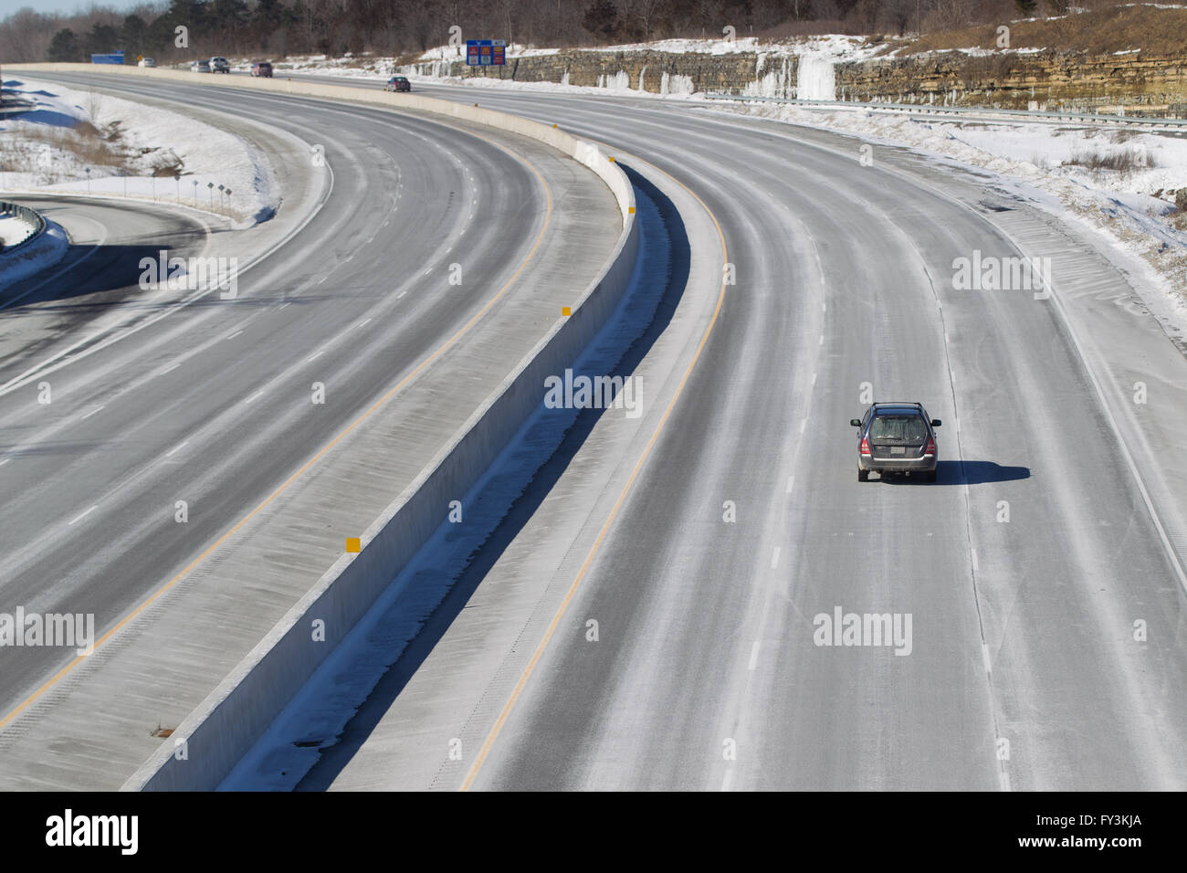 Cars and trucks drive on highway 401 in Kingston, Ontario, on March 3, 2016. Stock Photo