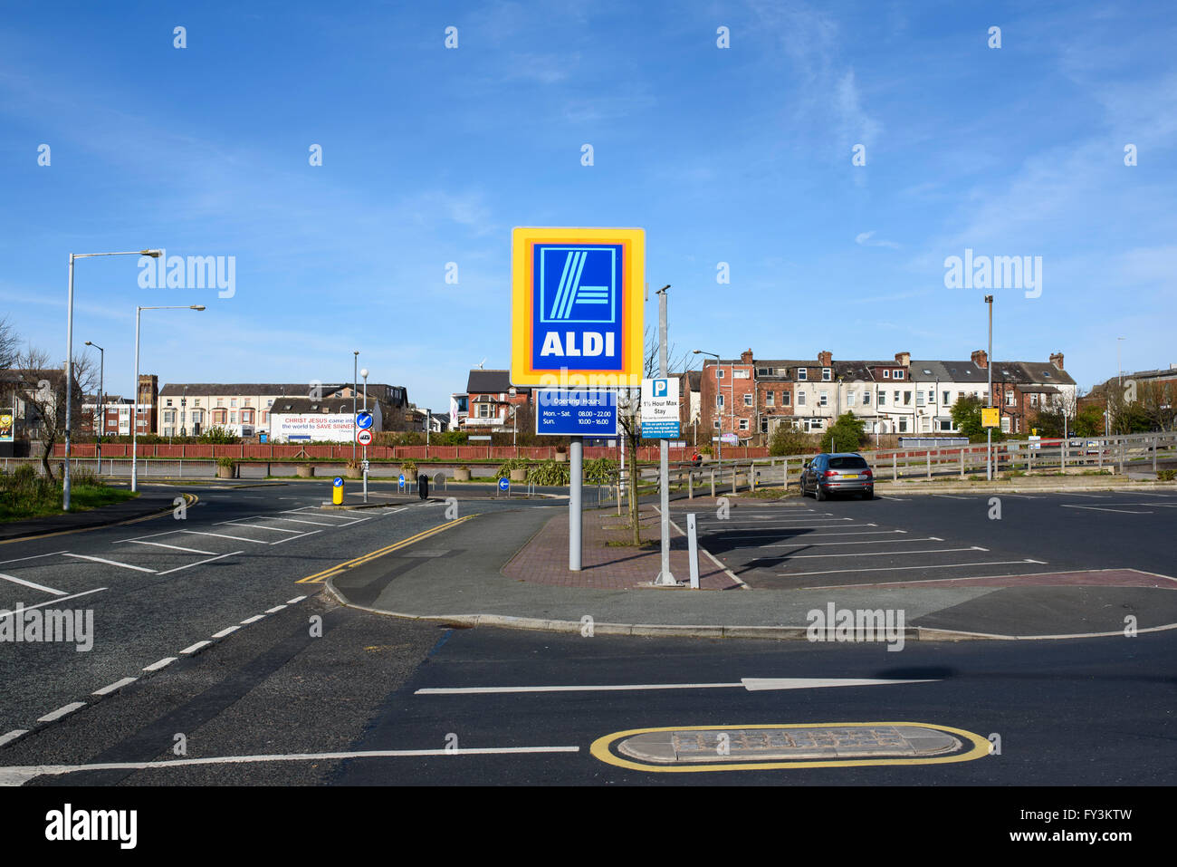Aldi sign at the entrance to the car park of a large Aldi supermarket in Blackpool, Lancashire, UK Stock Photo