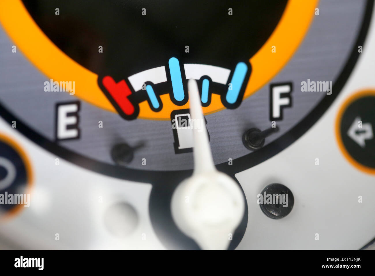 Fuel gauge with warning indicating quantity fuel tank,Gas gauge indicating white icon for gas station. Stock Photo