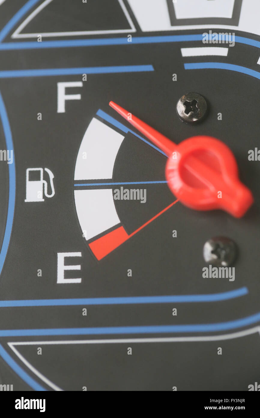 Fuel gauge with warning indicating quantity fuel tank,Gas gauge indicating white icon for gas station. Stock Photo