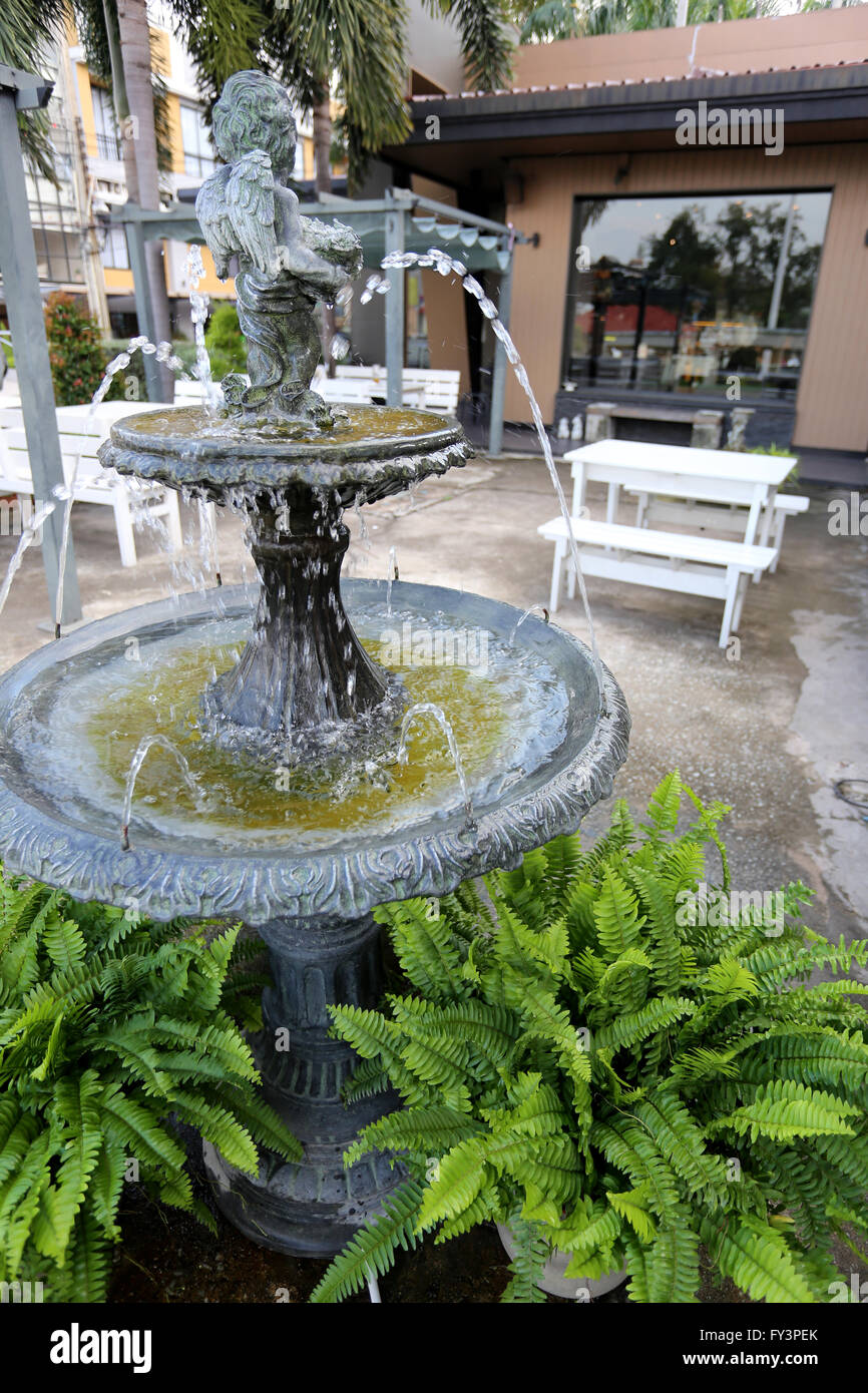 fountain in the garden of coffee shop Stock Photo Alamy