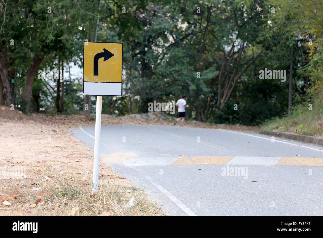 Warning signs for curves road,Street that traverses the mountain. Stock Photo