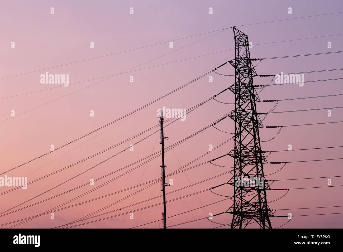 silhouette of high voltage electric tower in twilight sky Stock Photo ...