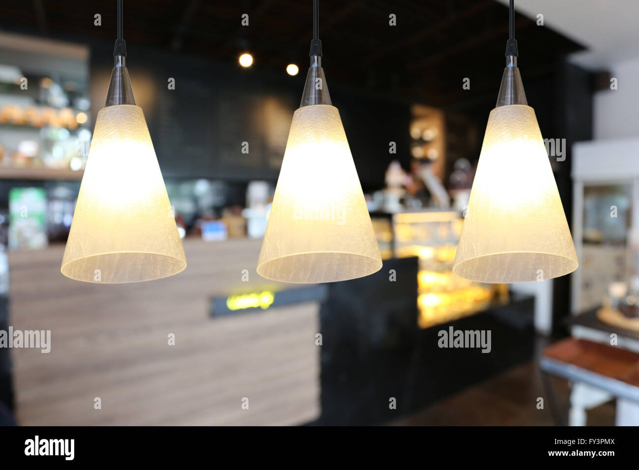 Warm lighting modern ceiling lamps in the cafe and interior decoration ...