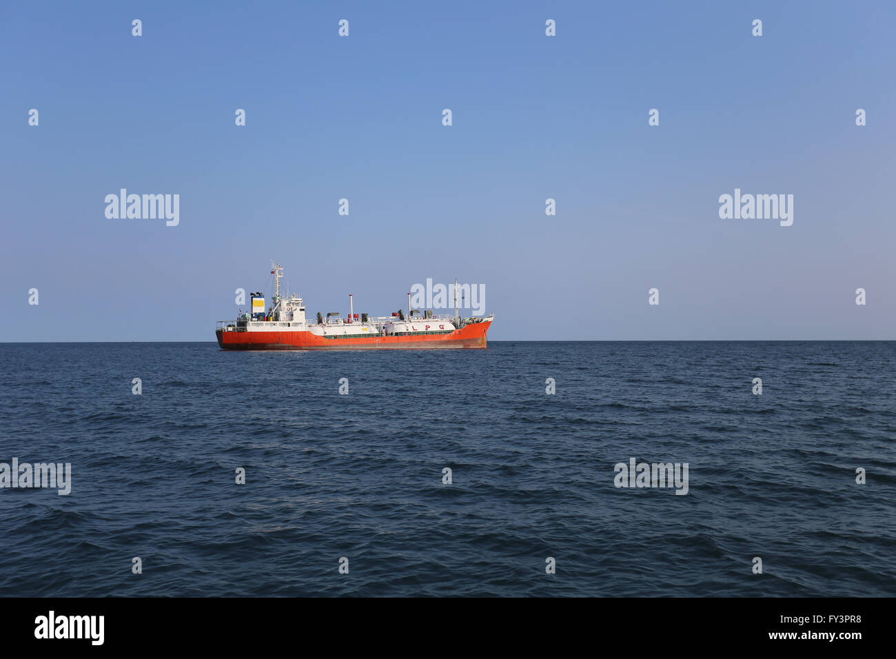 cargo ship in the sea,daytime sky. Stock Photo