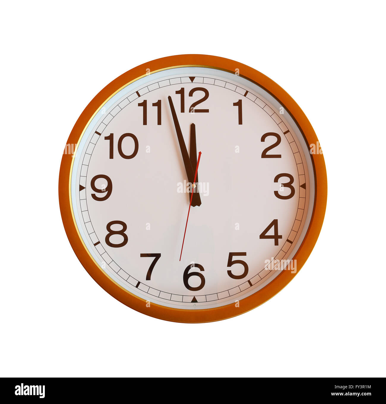 orange wall clock isolated in twelve o'clock on white background. Stock Photo